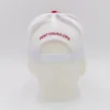 White mesh cap with red embroidery.