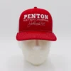 Red Penton champions cap on mannequin head.