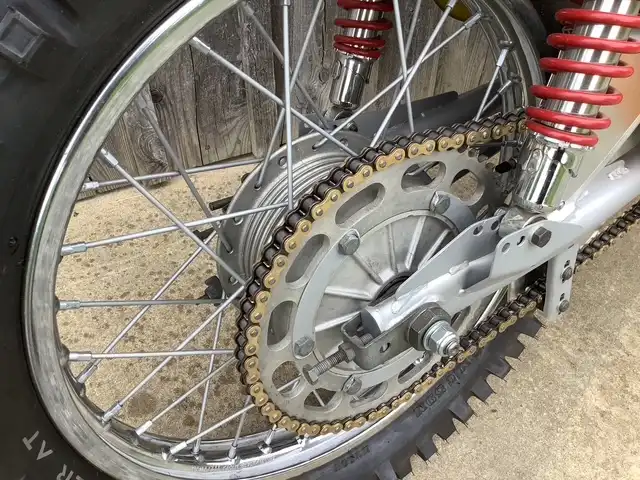 Motorcycle rear wheel with chain and shocks