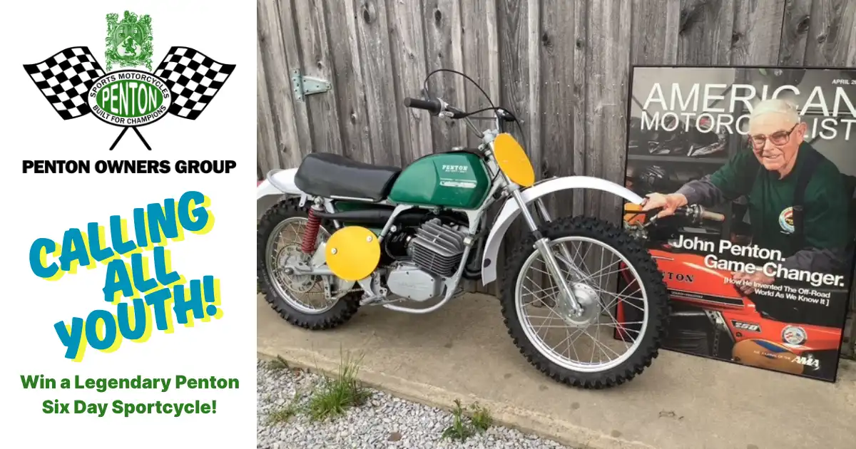 Penton motorcycle and John Penton poster displayed outdoors.