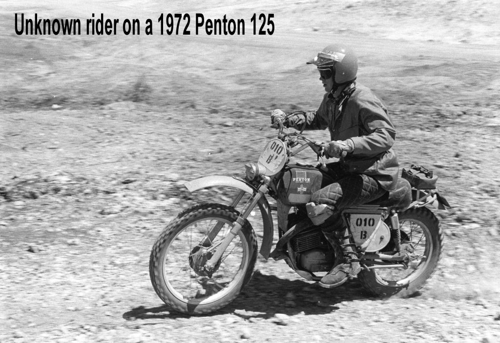 Motorcyclist riding vintage 1972 Penton 125 dirt bike.