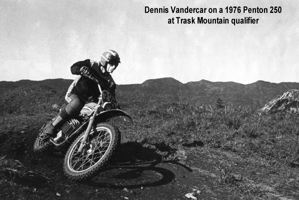 Motorcyclist rides vintage bike on dirt trail