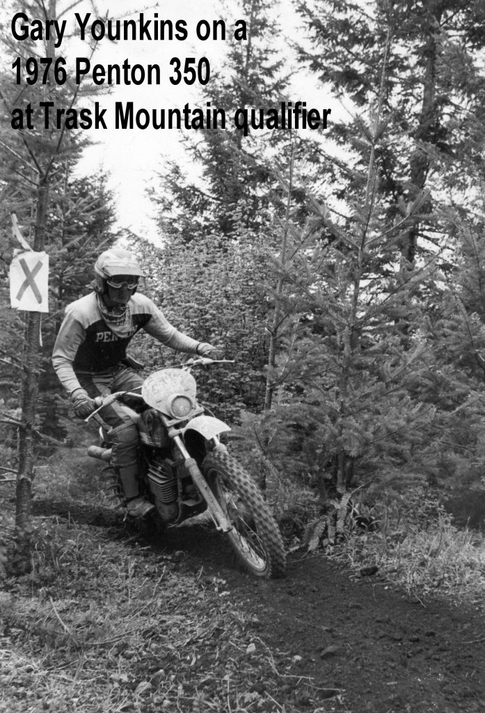 Motorcyclist on dirt trail during race event.