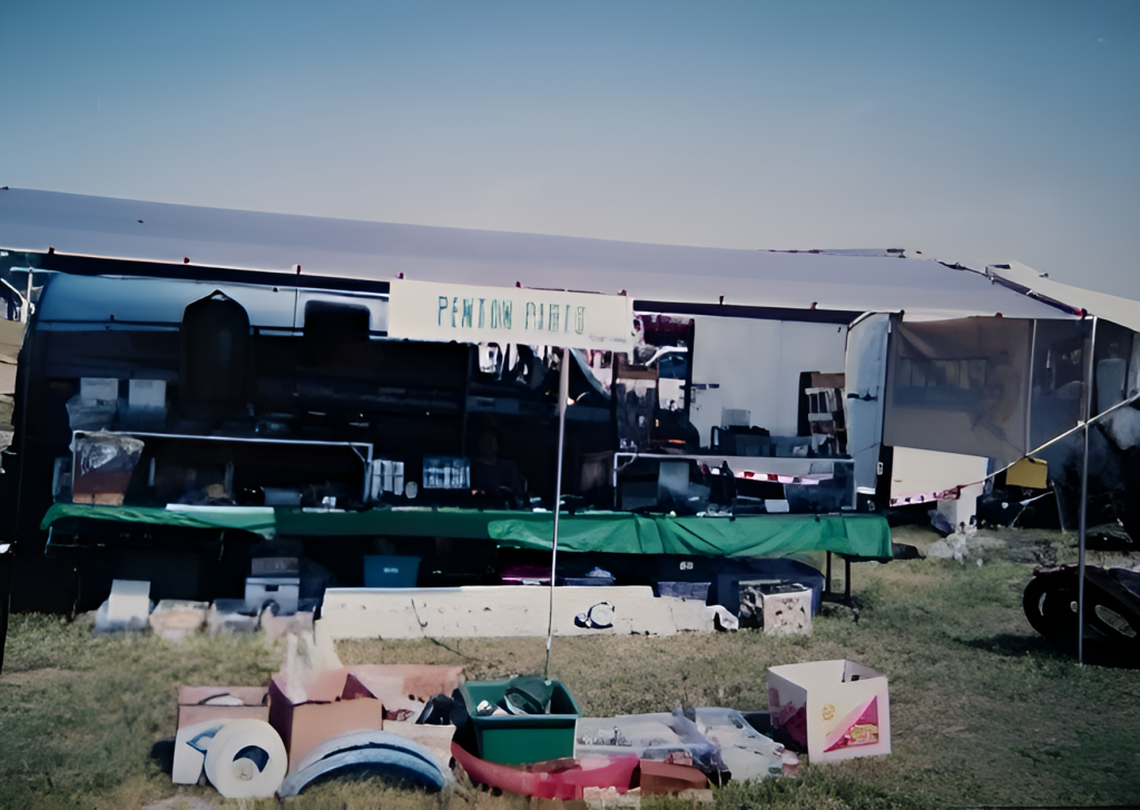 Outdoor market stall displaying various items.