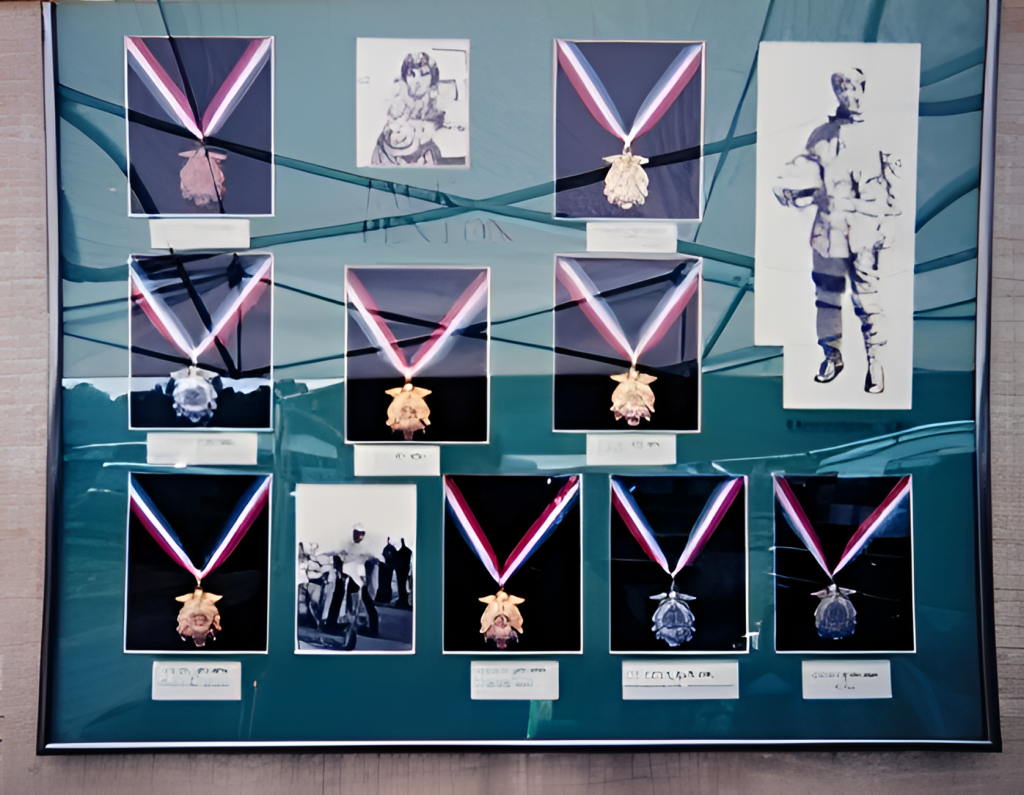Framed medals and historic photos on display.