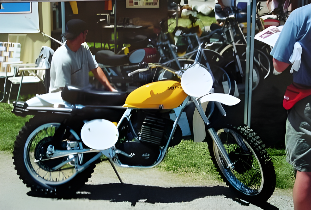 Vintage motorcycle on display at outdoor event.
