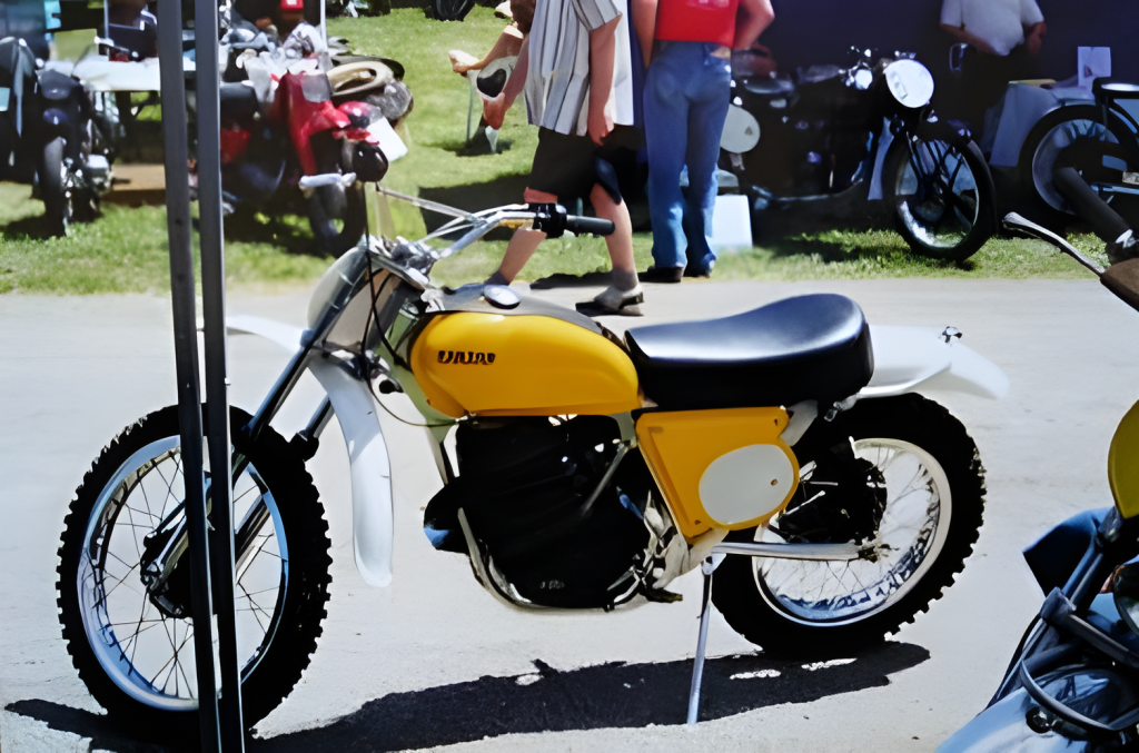 Vintage yellow motorcycle at outdoor event