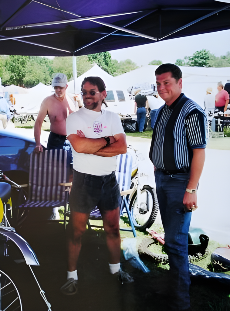 People at a motorcycle event outdoors.