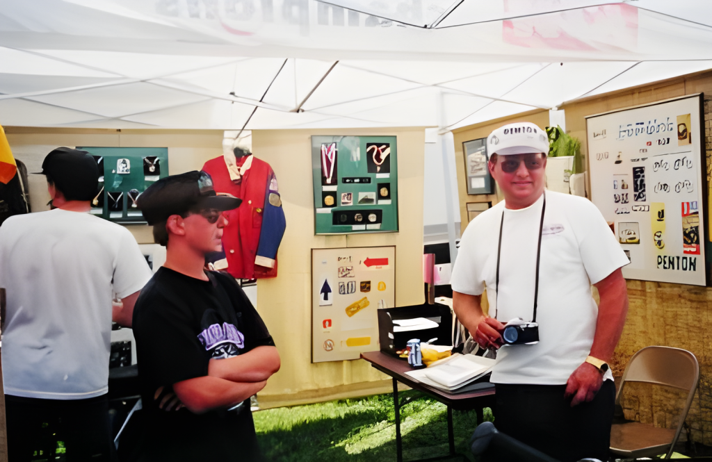 People at vintage exhibit booth with memorabilia