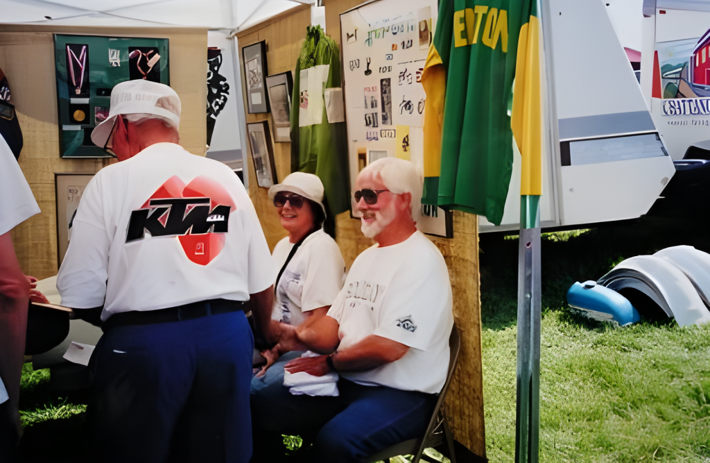 People in a tent with sports memorabilia.
