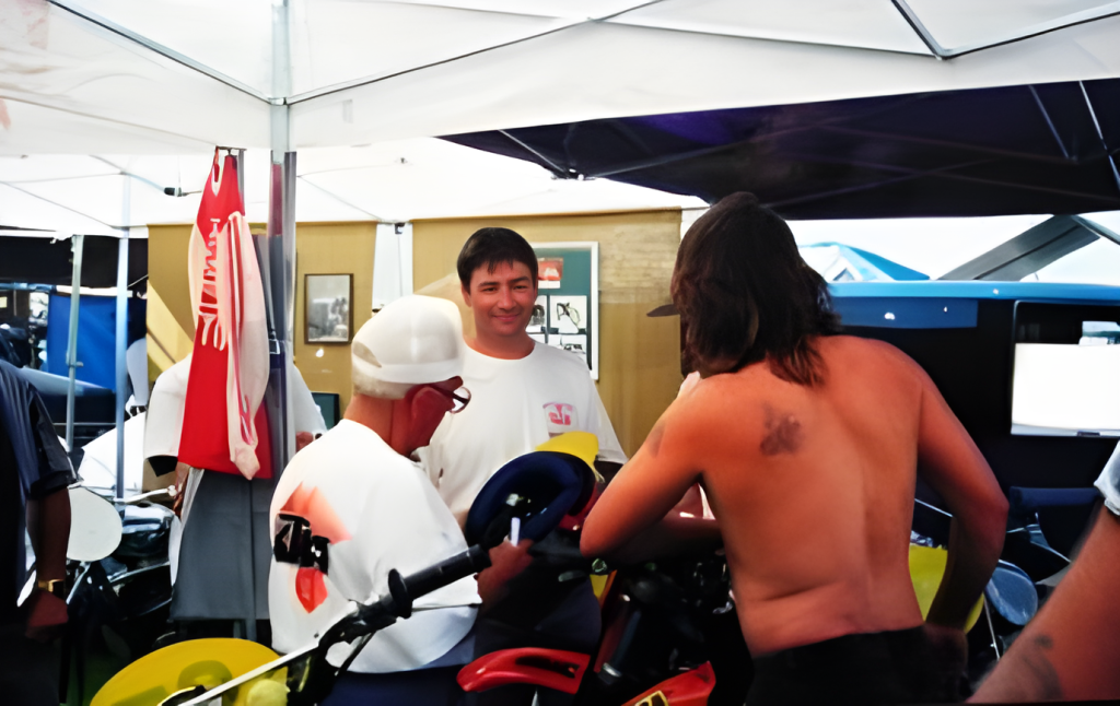 People in a tent discussing near equipment.
