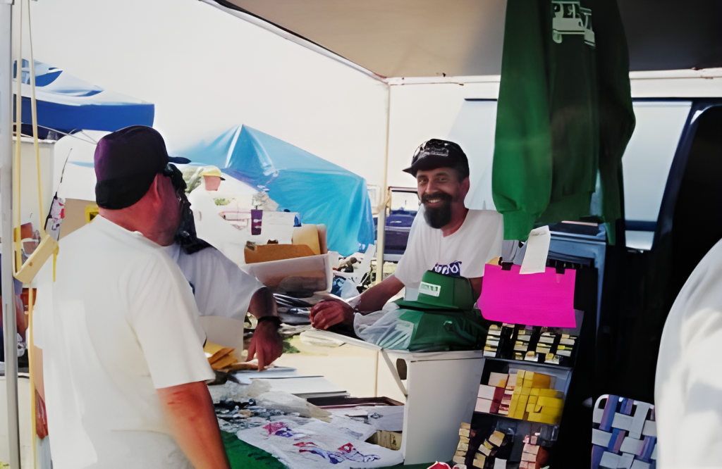 Smiling vendor at outdoor market stall