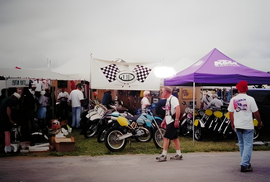 Motorcycle display at outdoor market event.