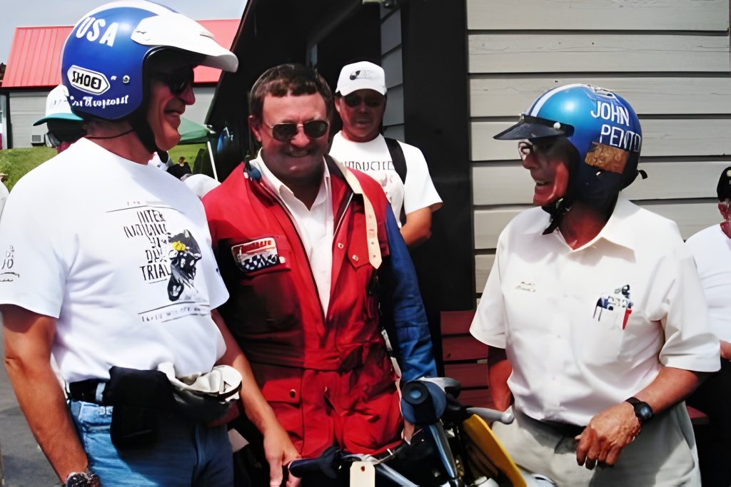 Smiling motorcyclists wearing helmets and gear