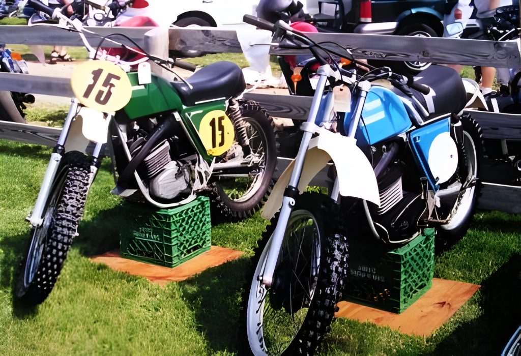 Vintage motorcycles on display in outdoor setting.