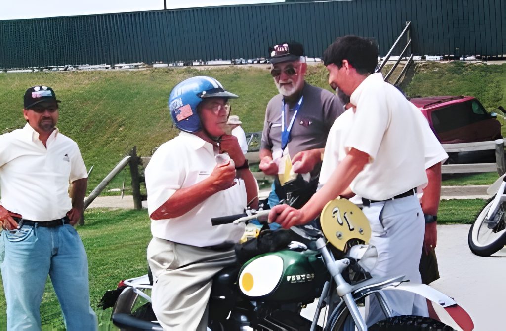 Group discussing by motorcycle outside