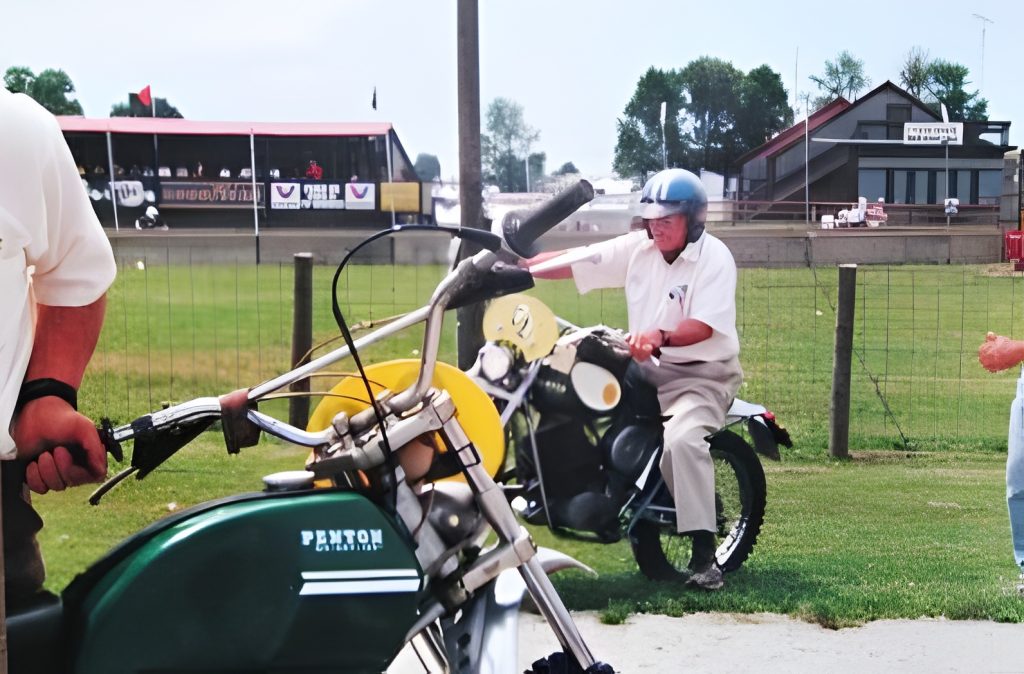 Man on motorcycle at racetrack event