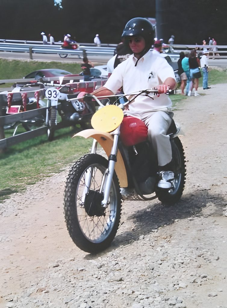 Person riding a dirt bike on a trail.