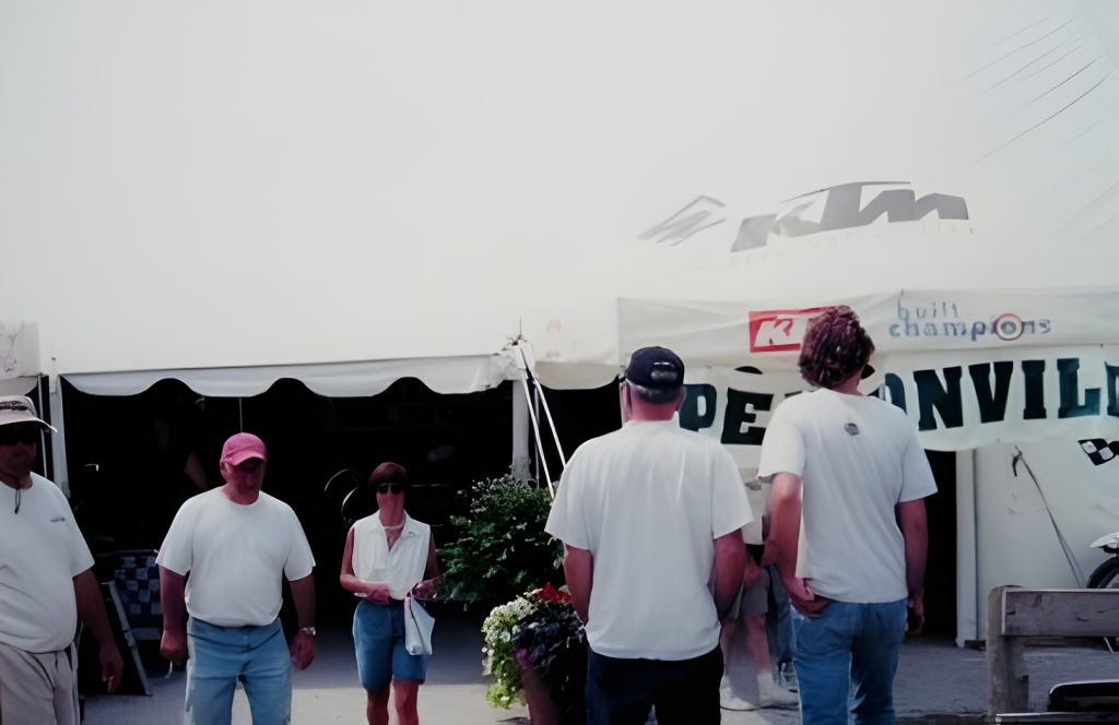 People at outdoor event under tents