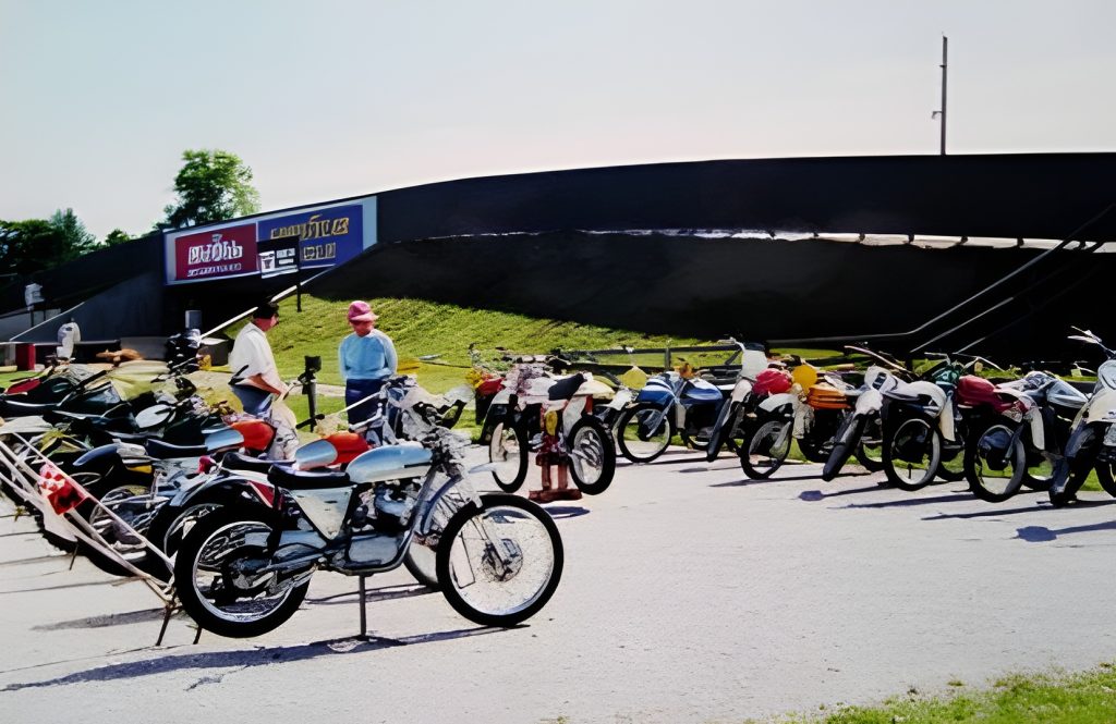Vintage motorcycles displayed outdoors in a row