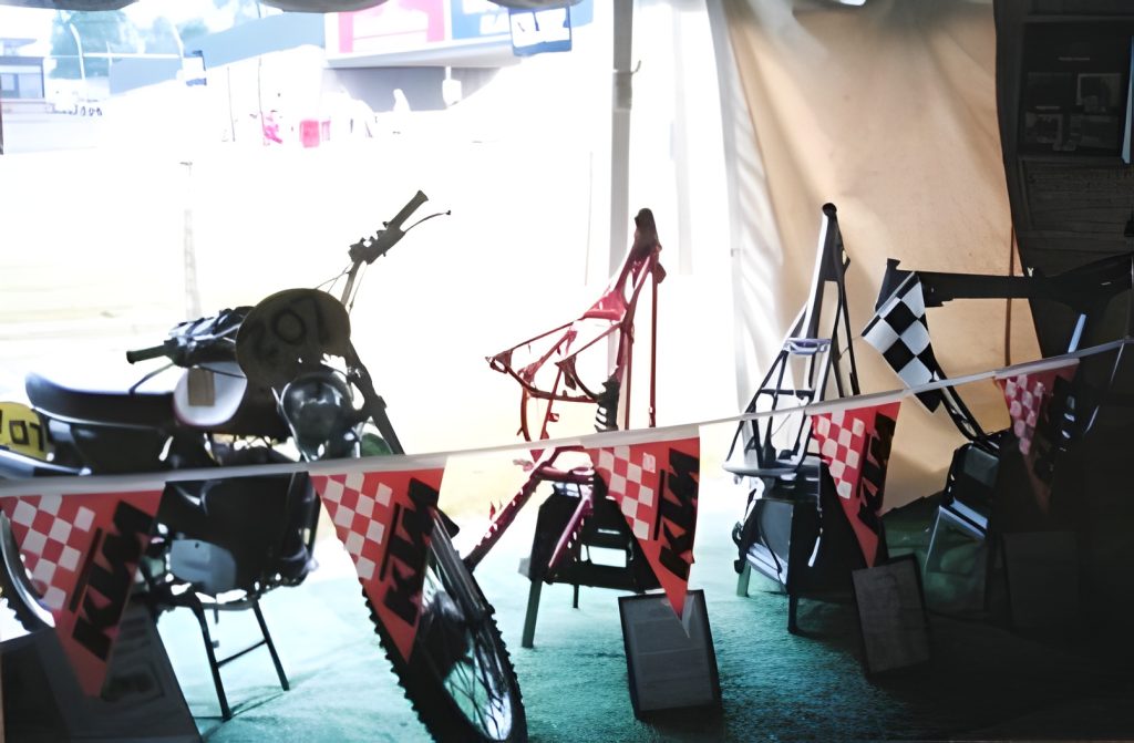 Motorcycle display with colorful flags and frames