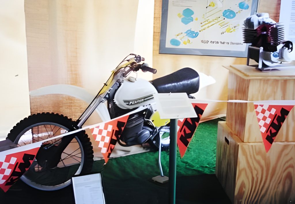 Vintage motorcycle displayed with engine model.