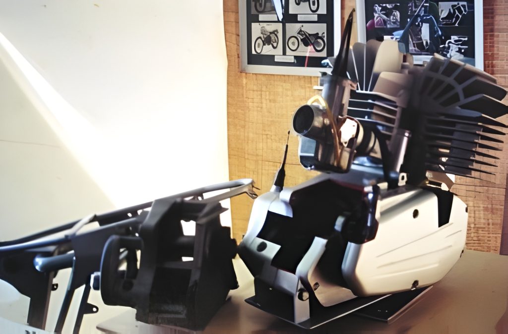 Exhibit of motorcycle engine and frame parts display