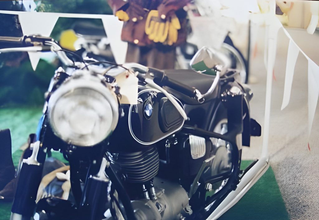 Vintage motorcycle on display with decor.