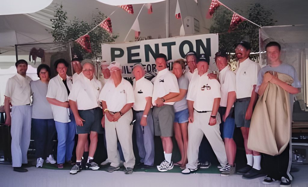 Group photo in front of Penton sign.