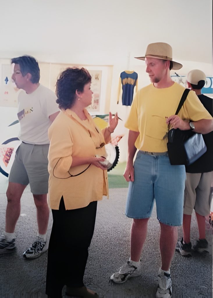 People conversing at an indoor event.