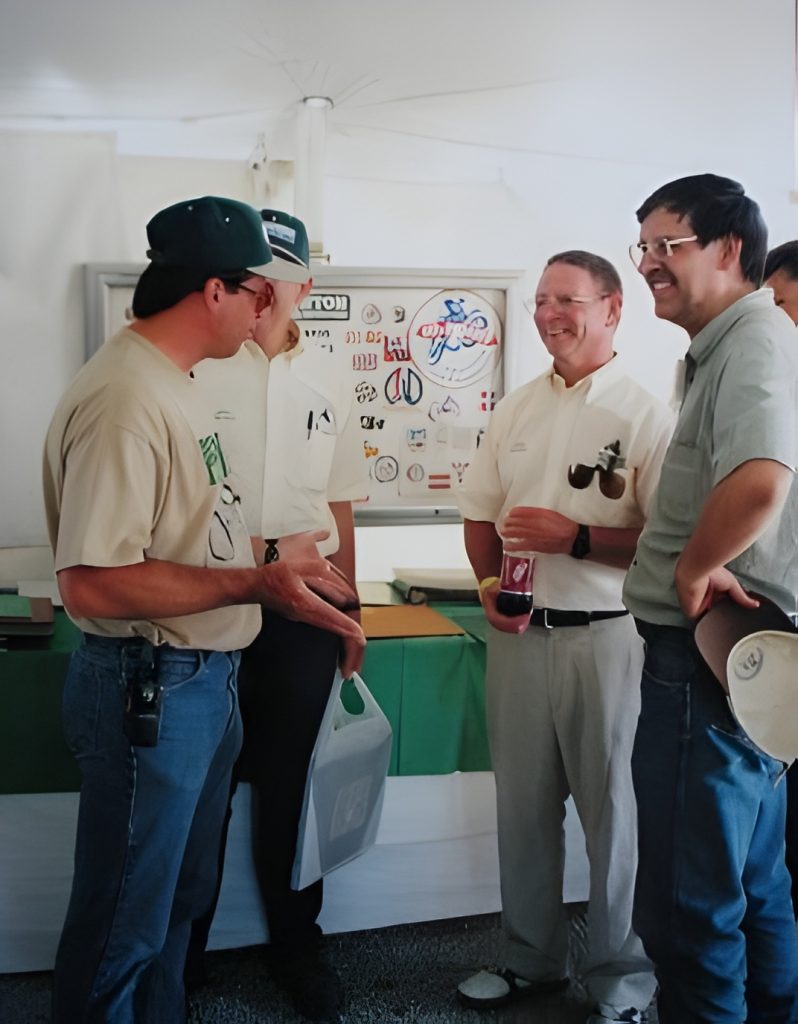 Group of people talking at an event.