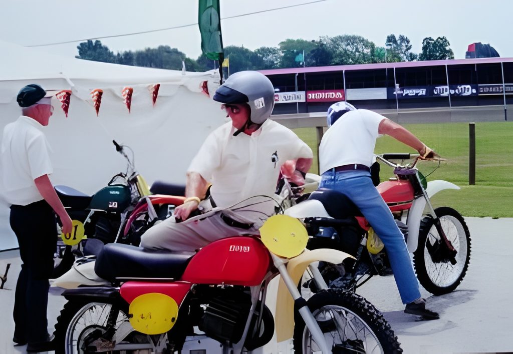 Men with motorcycles at outdoor event