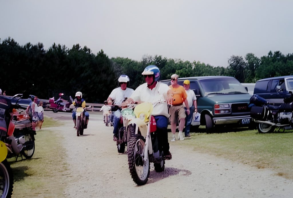 Group of people riding motorcycles outdoors