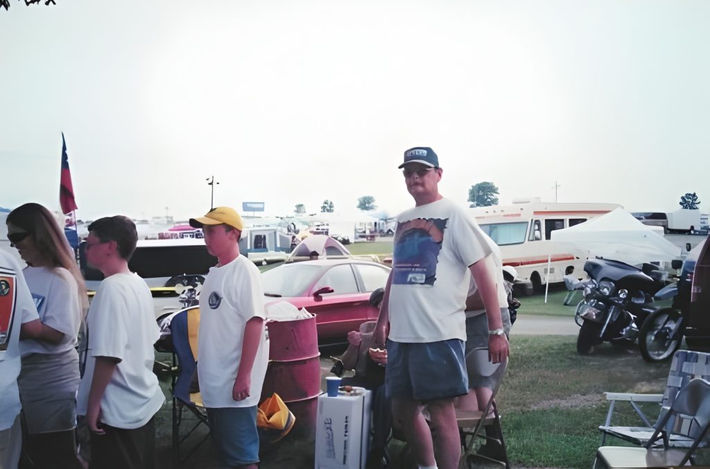 People standing outside at a campsite