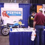 Penton motorcycle display at a trade show booth.