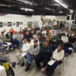 People attending an indoor seminar in a museum.