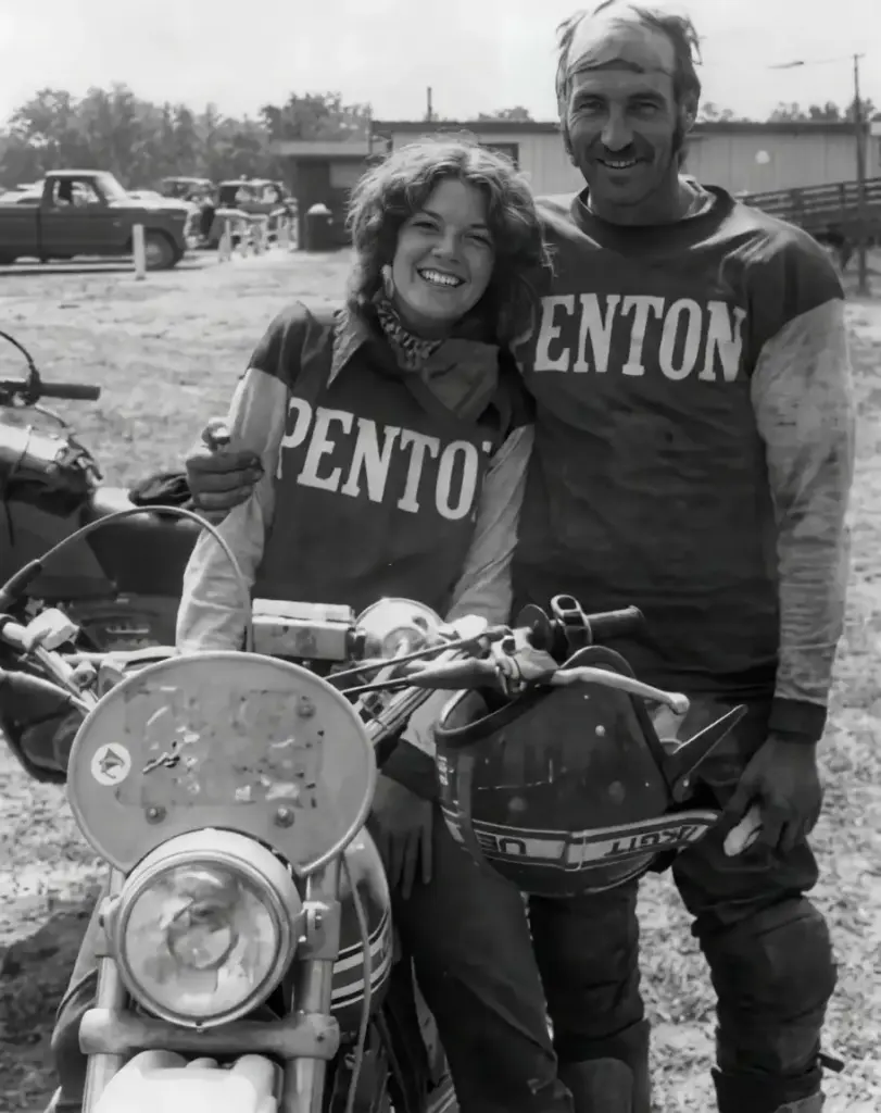 Tony and her dad in Penton shirts with motorcycle.