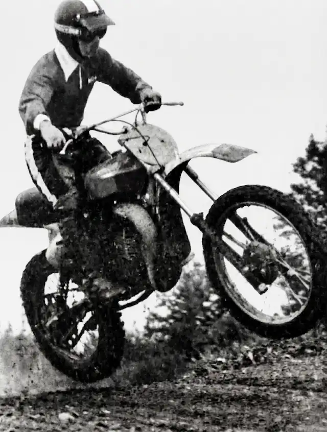 Motorcyclist jumping during off-road race