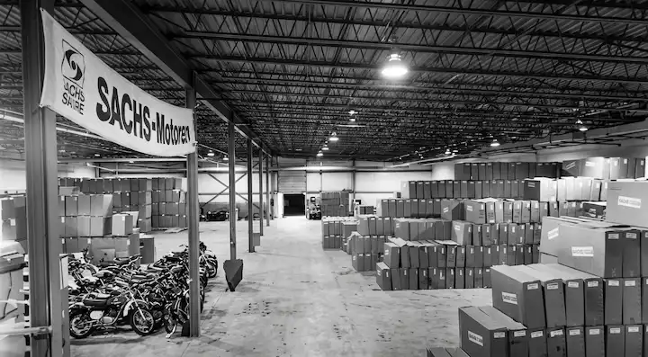 Warehouse with boxes and motorcycles.
