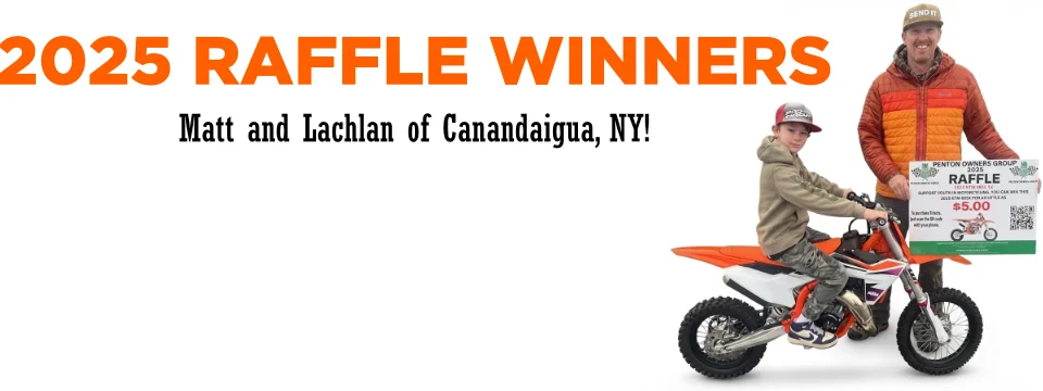 Father and son winning raffle with dirt bike