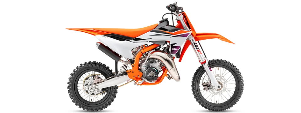 Orange and white motocross bike side view